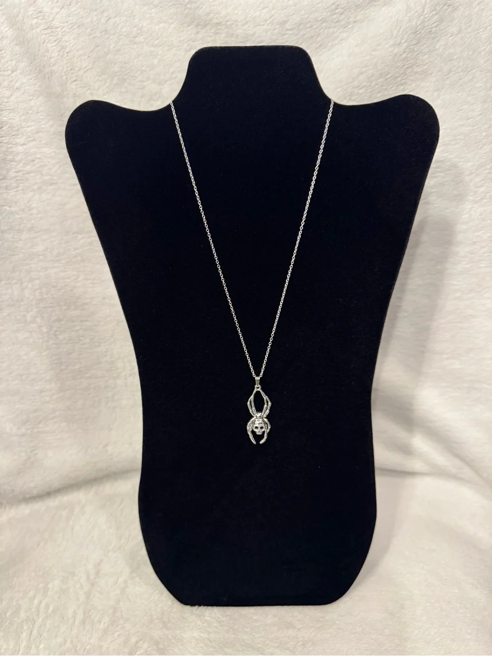 Silver spider pendant necklace with skull design